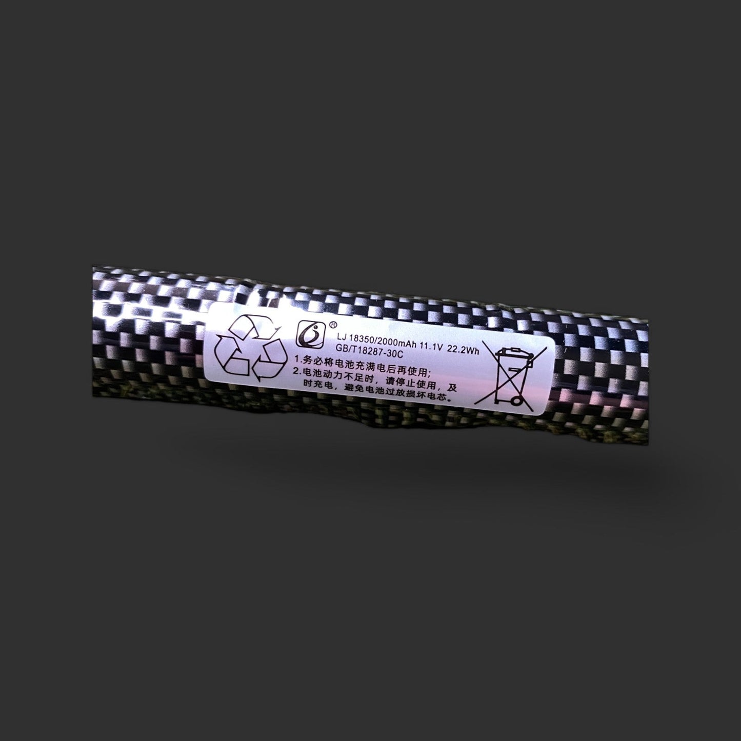 BlasterMaster 11.1V 18350 2000mAh SM2 30C long skin battery with white informational label detailing recycling symbols, high-efficiency battery caution icons, and Chinese text on a gray background.