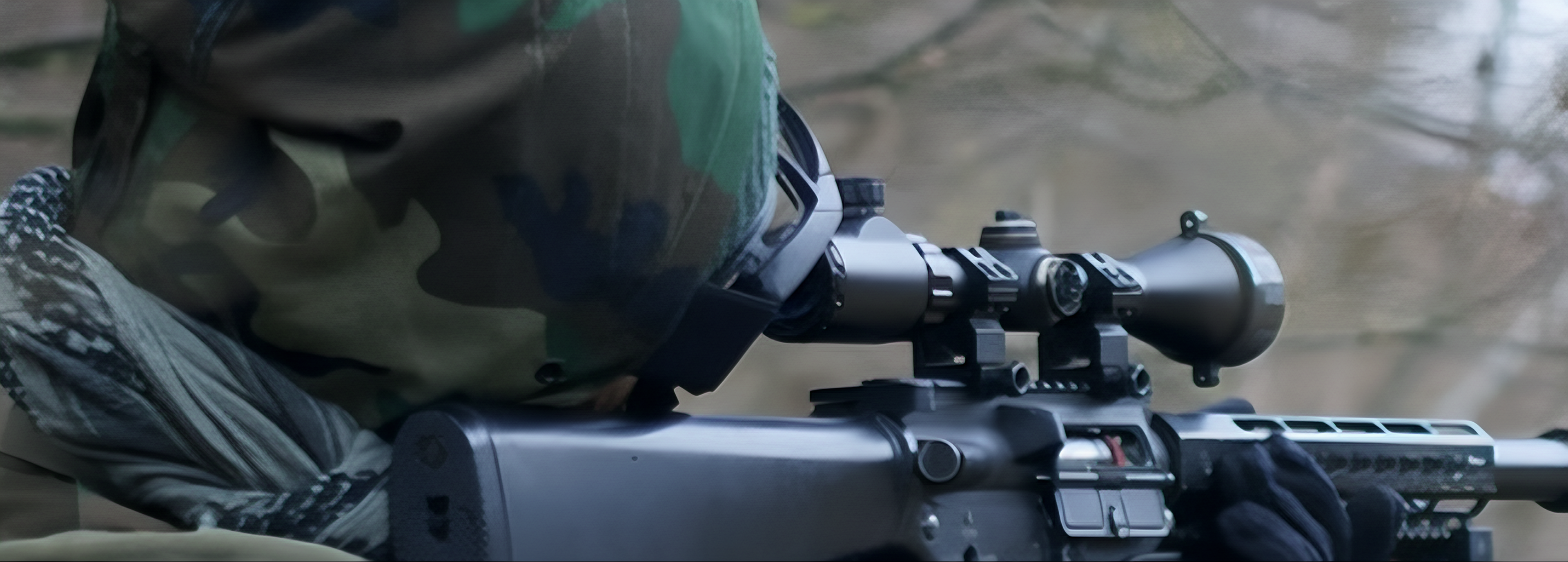 <img src="man-looking-through-scope.jpg" alt="Man focusing through a rifle scope hunting">